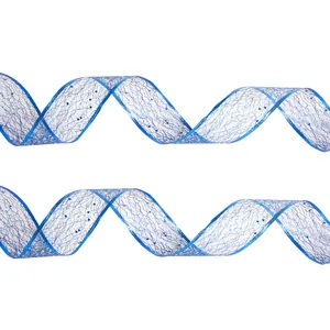 Macro detail of blue wavy mesh Christmas ribbon with sparkling glitter for gift wrapping.