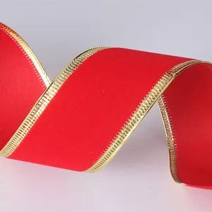 Close-up of premium red velvet ribbon with elegant gold wired edge for Christmas DIY