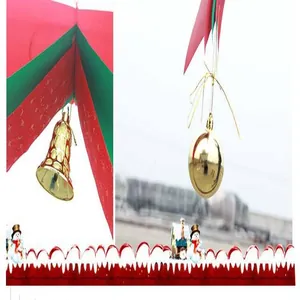 Detail of Christmas wave banner with golden bell and ball ornaments for ceiling decoration