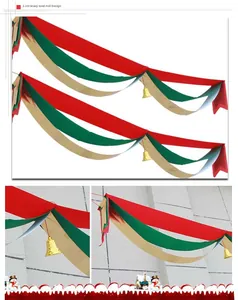 Close-up detail of festive Christmas wave bunting featuring red, green and gold layers.