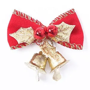 Red velvet Christmas bow ornament featuring gold bells and glittery leaf accents
