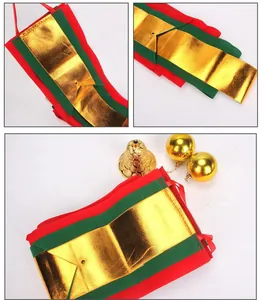 Detail view of festive red, green and gold Christmas ribbon flags with shiny gold texture