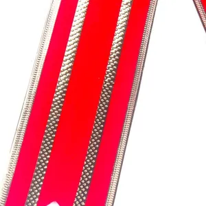 Decorative red velvet Christmas ribbon featuring shimmering gold metallic wired edges
