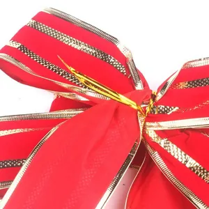 Decorative red Christmas bow with elegant gold edges for festive tree ornaments