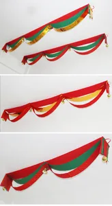 Set of festive red green and gold Christmas wave banners for ceiling party decor.