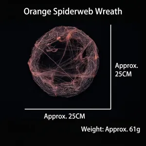 Detail of orange spider web rattan wreath for Halloween decor, 25cm diameter.