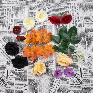 Assortiment kunstzijde bloemhoofdjes en esdoornbladeren voor doe-het-zelf decoratie