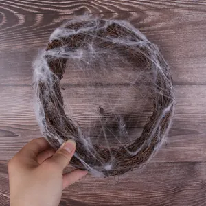 Close-up of Halloween vine wreath with realistic spider web for DIY party decor