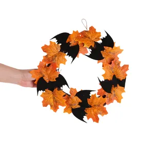 Halloween hanging wreath decoration featuring orange maple leaves and black bats for door