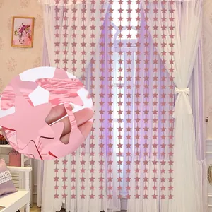Close-up of metallic rose gold star fringe curtain for party backdrop decoration