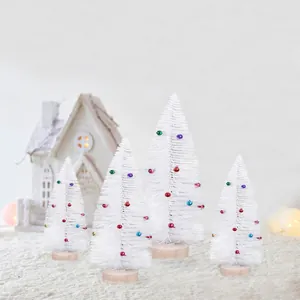 Set of 4 white mini Christmas trees with colorful bell ornaments for holiday desk decor