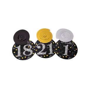 Close-up of black and gold birthday spiral hanging decorations with glittery numbers