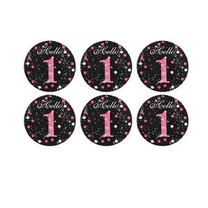 Detail view of six black and pink glitter Hello 1 hanging party circle decorations