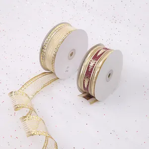 Detailed view of festive gold and burgundy wired ribbons with Christmas tree patterns