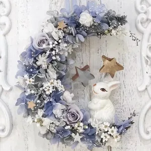 Handmade crescent moon floral wreath with white rabbit and wooden stars