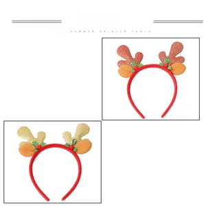 Detailed view of cute Christmas reindeer antler headbands in red and gold glitter finish