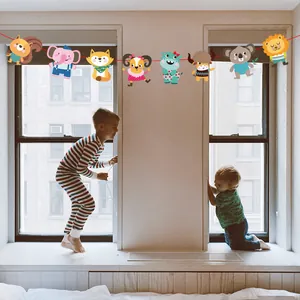 Vibrant cartoon animal garland party decoration hanging in a cozy kids bedroom setting
