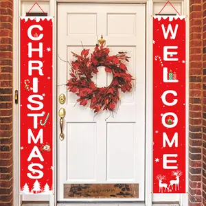 Festive red Christmas Welcome banners hanging on a white front door with a red wreath