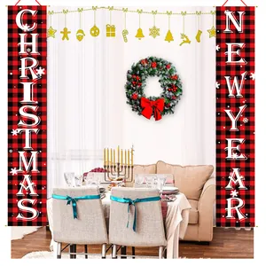 Red and black plaid Christmas and New Year banners displayed in a festive dining room