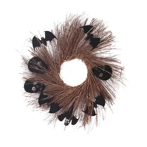 Handmade Halloween wreath featuring black decorative bats and spooky skulls for wall decor