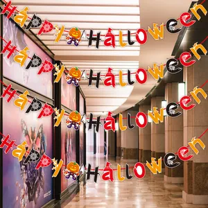 Detailed view of festive Happy Halloween hanging banner with pumpkin and spider web motifs