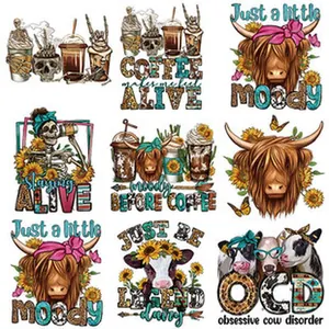 Detailed view of western highland cow and coffee theme heat transfer patches for garments