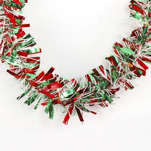 Macro view of red, green, and white festive tinsel garland for holiday decoration