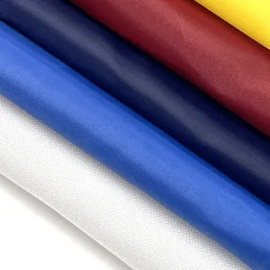 Close-up of durable multi-color fabric rolls for manufacturing protective car hood covers