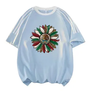 Detailed close-up of Mexican Independence Day sunflower heat transfer on blue T-shirt