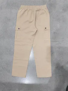 Detail of khaki men's cargo pants featuring large side pockets and elastic waist