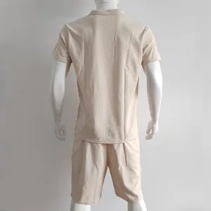 Back view of men's beige waffle knit polo and shorts set on a mannequin