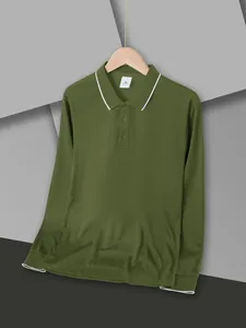 Detailed macro view of a dark green quick-dry long-sleeved polo shirt with white trim