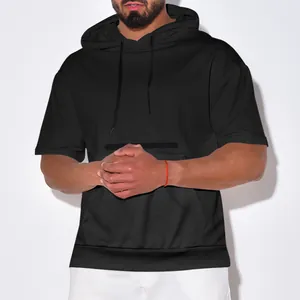 Detail view of men's black waffle knit hooded t-shirt with heavy fabric texture