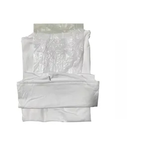 Detail view of folded white cotton tank top with protective moisture-proof paper