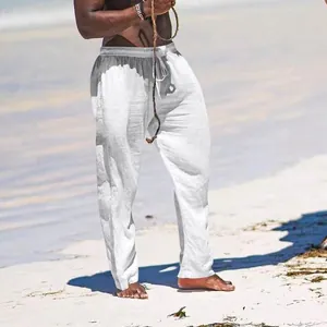 Men's breathable white cotton linen leisure trousers shown in a beach setting