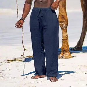 Detail view of men's navy blue wide-leg trousers showing the relaxed and loose fit.
