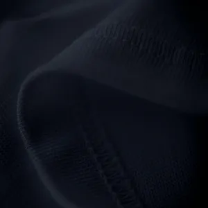 Macro detail of high-quality navy blue knitted fabric and precision stitching