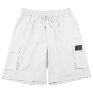 Detailed view of white men's outdoor cargo shorts with elastic waist and pockets