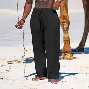 Loose fit breathable black cotton linen wide-leg pants for men shown on summer beach
