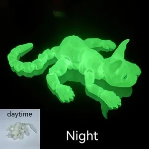 Articulated 3D printed hairless cat figurine showing daytime look and night glow effect