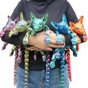 A collection of articulated 3D printed Sphynx cat models in various vibrant metallic colors