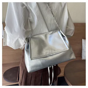 Minimalist silver metallic shoulder bag with elegant chain strap and high-gloss finish