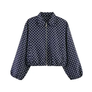 Detailed front view of a navy blue retro polka dot cropped jacket with full zipper