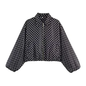 Detailed view of vintage black and white polka dot cropped jacket with front zip closure
