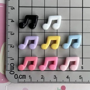 Mini glossy music note resin charms for DIY phone case crafts with cm ruler size guide