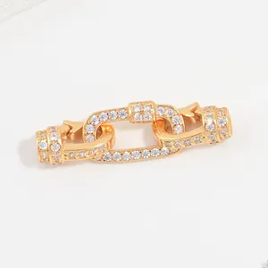 Close-up of gold-plated S925 silver rectangular chain clasp with glittering cubic zirconia.