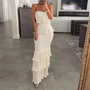 Elegant white strapless tiered ruffle maxi dress for summer beach or party wear.