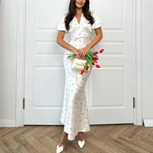 A detailed view showing the elegant white floral print V-neck maxi dress for summer wear.