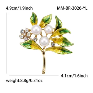 Detailed view showing dimensions of a pearl and rhinestone inlaid branch brooch.