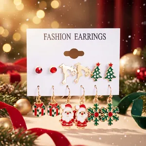 Detailed view of the diverse Christmas enamel earring set with festive motifs